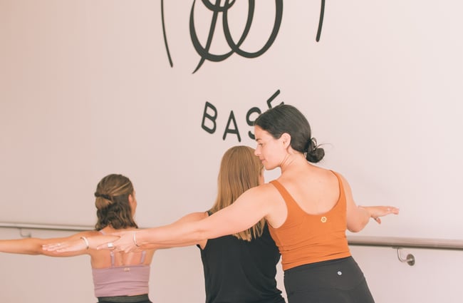Instructor assisting at Barre Base.