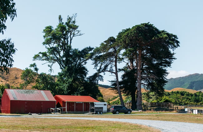 Red sheds and rolling hills.