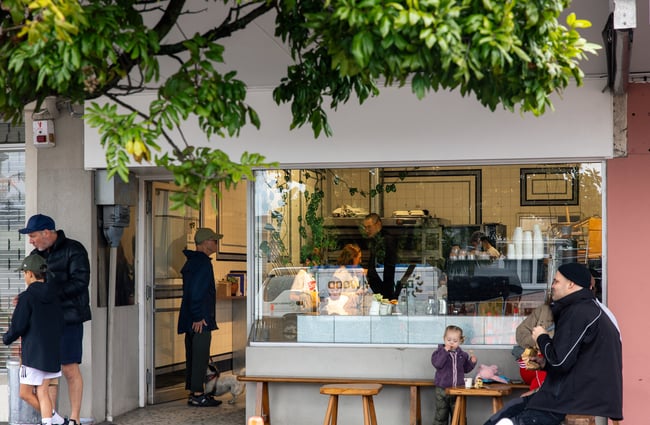 People sitting at a table outside Beabea's Bakery Auckland.