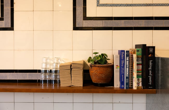 Books on a floating shelf.