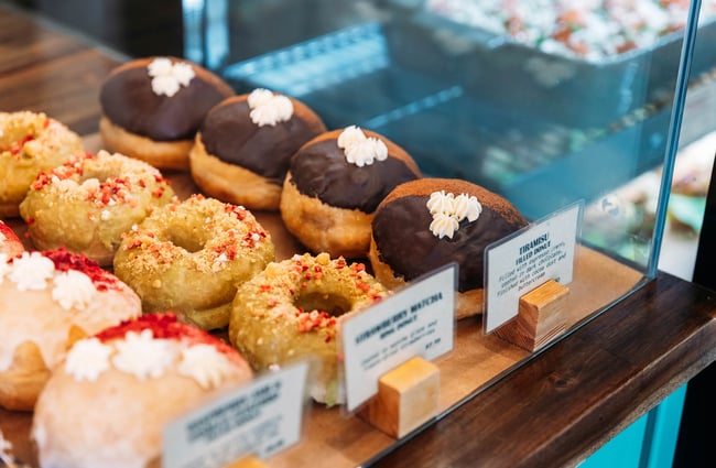 Donuts in cabinet at Belen Plant Bakery in Petone