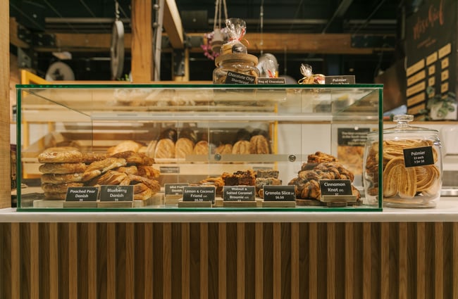 Pastries behind a glass counter at Bellbird Bakery Riverside Market.