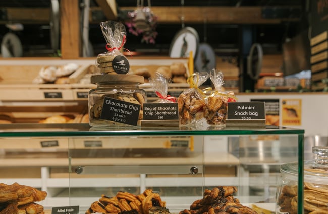 Sweet treats wrapped and placed on top of a glass cabinet.
