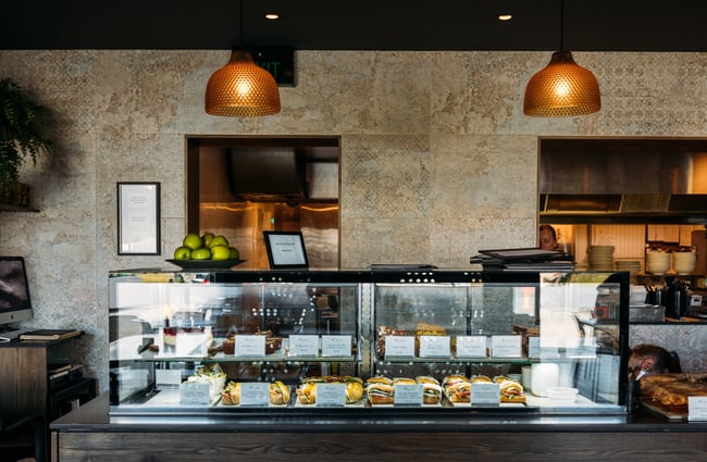 A glass counter inside a cafe.