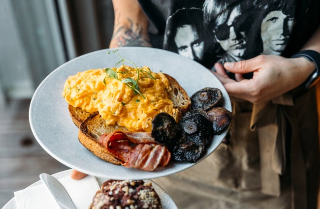 Scrambled egg and mushrooms on toast.