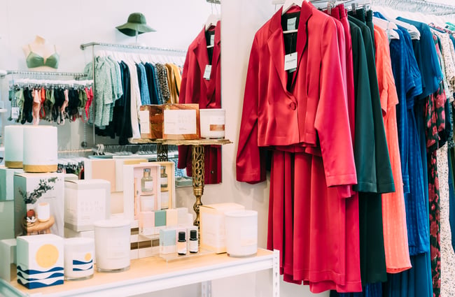 Colourful clothing on rack at Belle Bird Boutique.