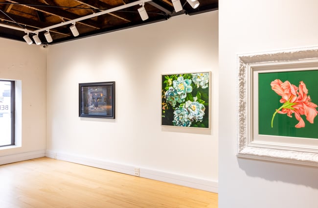 Painted flowers framed on walls.