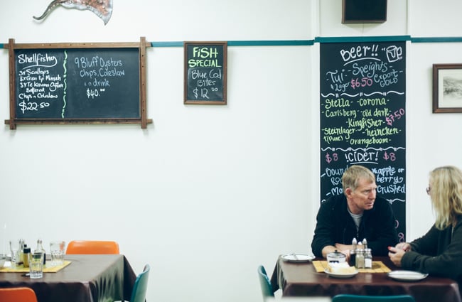 Blackboard menus on the wall.