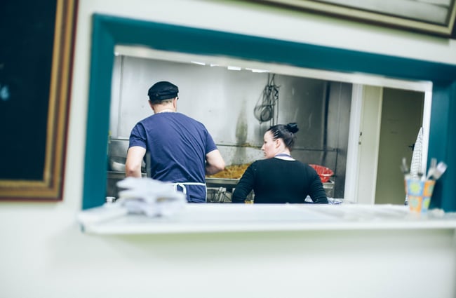 Looking into the kitchen through a peep window.