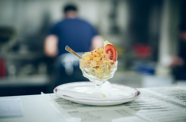 Mac and cheese in a glass goblet.