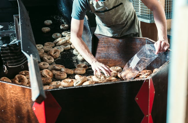 Bagels in bulk in the oven.