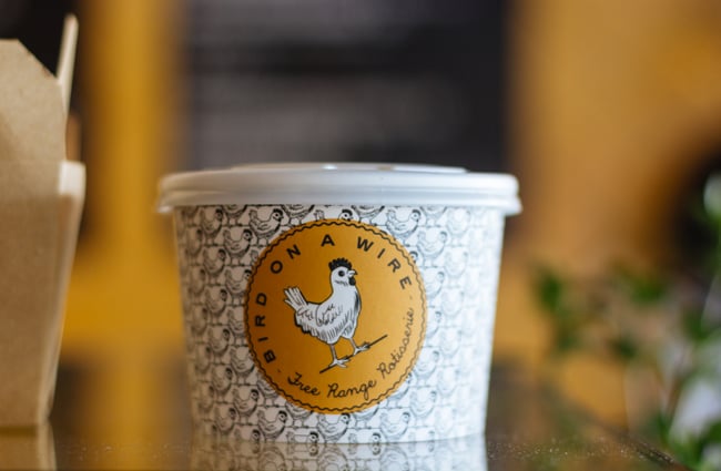 Black and white packaging with yellow brand sign.