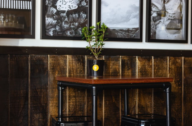 Wooden table against wooden wall.