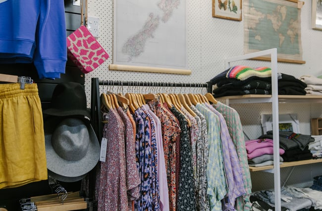 Rack of clothing and shelves of jumpers at Black & Co, Timaru.