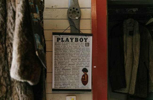 Playboy poster on the wall at Black & Co, Timaru.