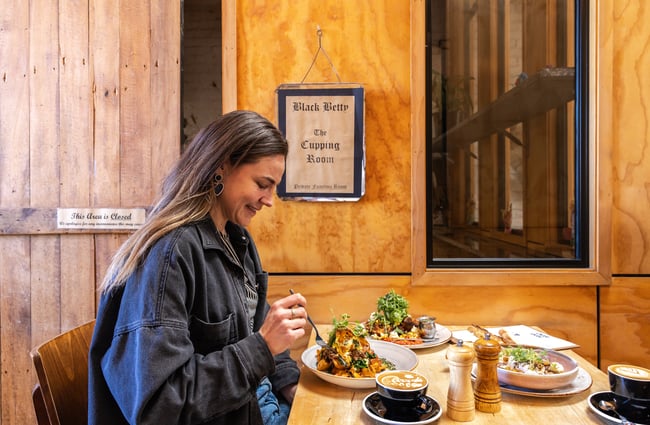 Customer eats a meal at Black Betty.