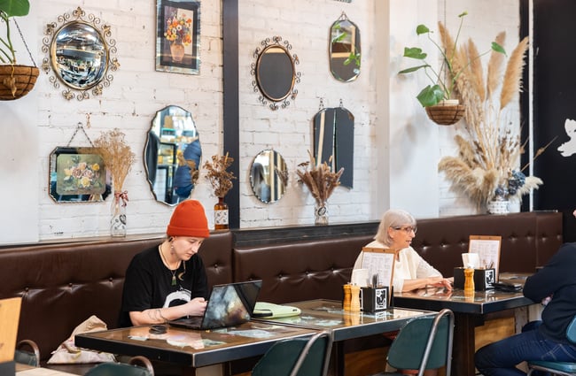Customers sit at tables at Black Betty.