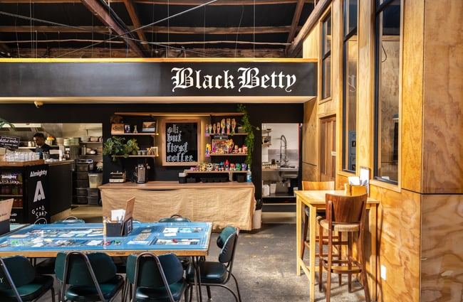 Front counter with table in the foreground at Black Betty.