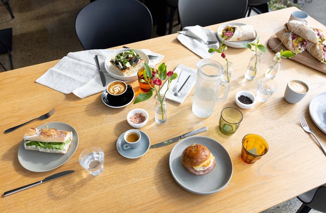 A flatlay of food and beverages on a table.