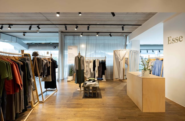Clothes on racks inside Bloc Auckland.