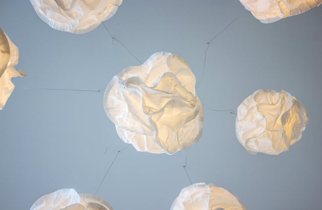 White decorations hanging from the ceiling.