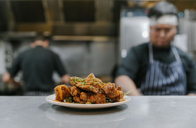 Plate of fried chicken on the kitchen pass at Blue Lake Eatery and Bar, Tekapo.