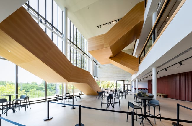 Main foyer area of BNZ Theatre in Hamilton with seating and view of staircase