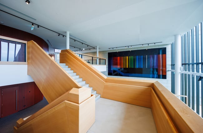 Staircase at BNZ Theatre in Hamilton with colourful artwork on wall