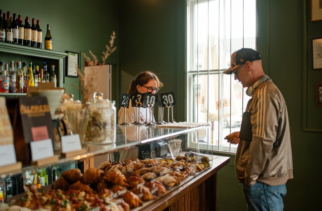 Customer ordering pastries at Bodega.