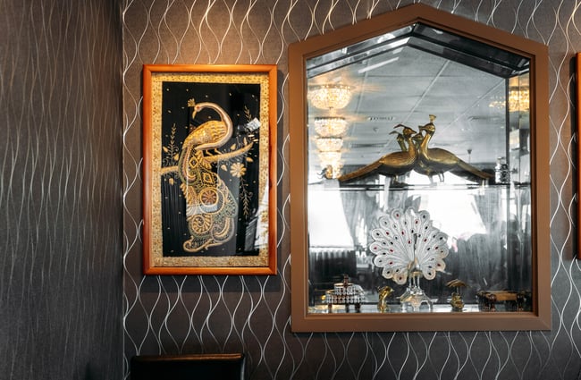 Indian decorations on a wall inside a restaurant.