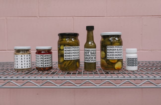Lineup of Bones Pickles' products on a shelf.