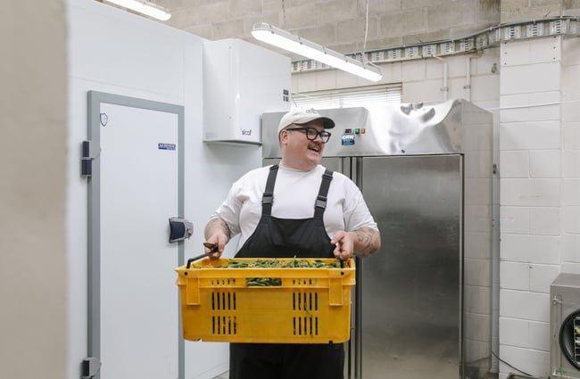 Chef in the kitchen at Bones Pickles.