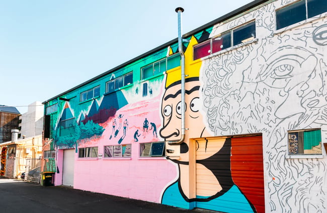 A colourful painted mural of a face.