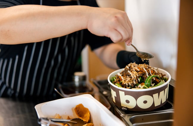 Chef preparing a bowl at Bowler.