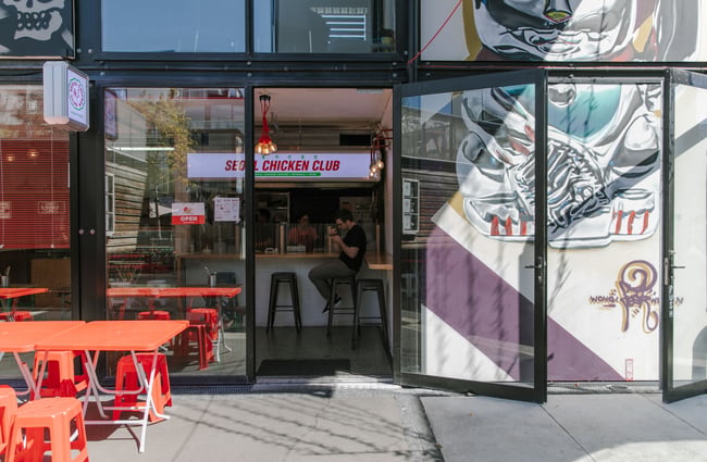 A man dines at the bar inside Seoul Chicken Club in BOXed Quarter in Christchurch.
