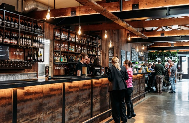 Customers ordering at the bar area at Brew Union.