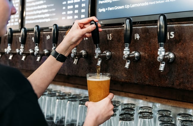 Bartender pouring a pint at Brew Union.
