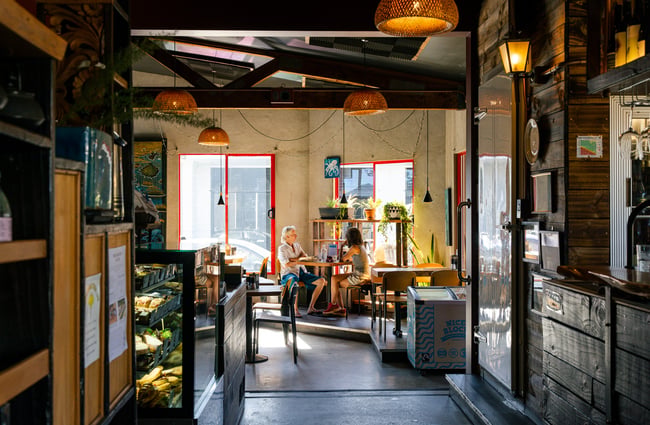View of the cafe's dining space inside at Brewed As.