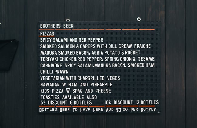 Black menu with white writing.