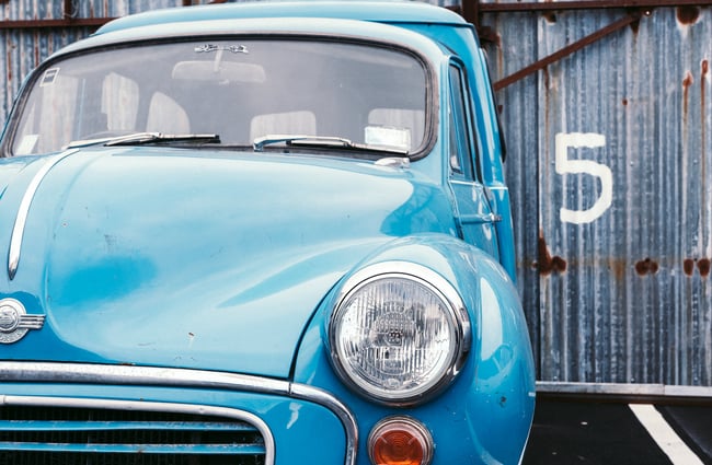 Retro blue car outside.