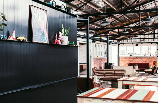 Colourful wooden tables inside.