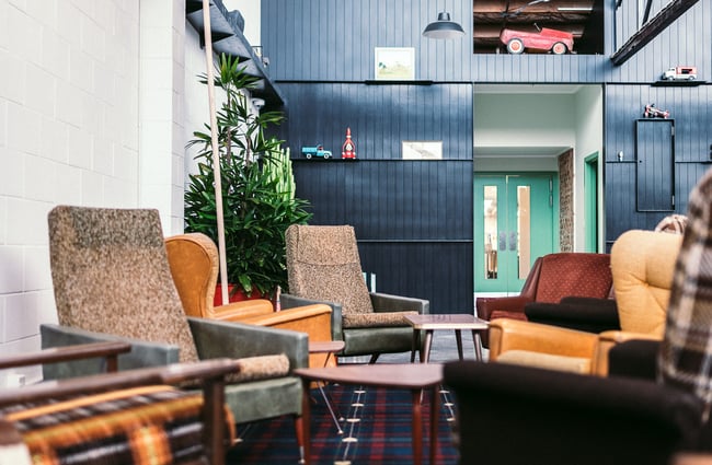 Tartan floor with vintage seating.