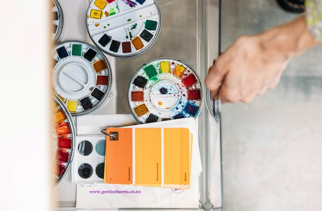 Water colour paints on a table.