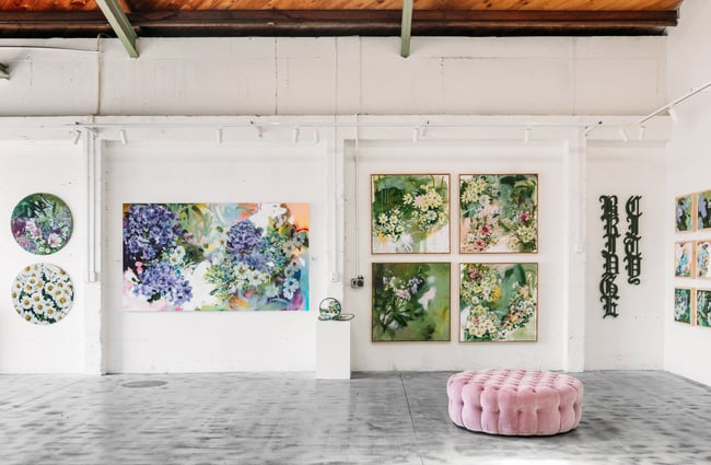 Art works on a white wall.
