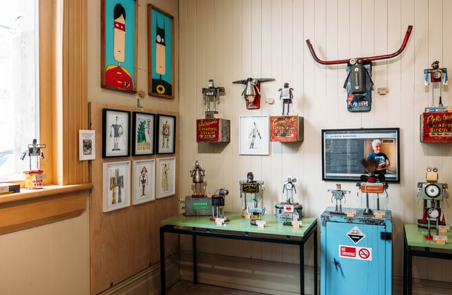Superhero-inspired artwork on the wall at Buggyrobot in Ōamaru