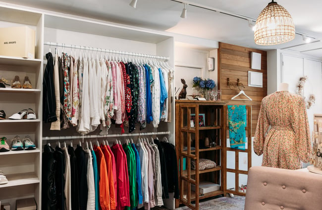 Clothes on multiple racks inside Bunnies Arrowtown.