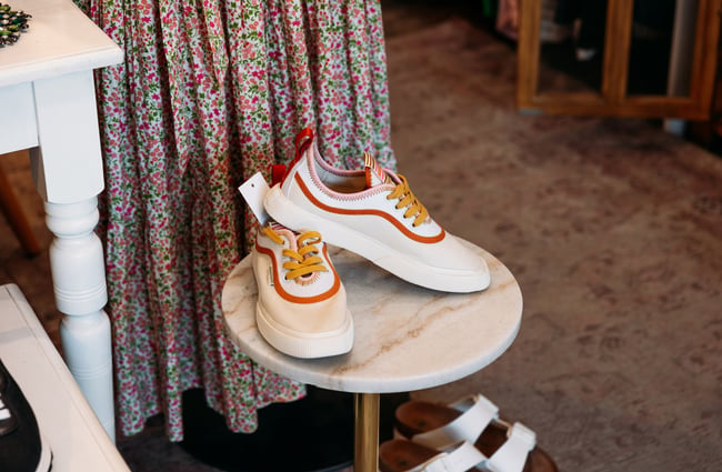 A pair of colourful sneakers on a chair.