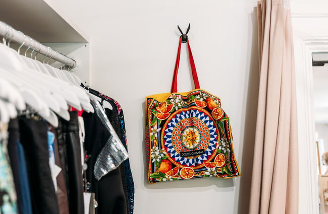 A colourful bag on a wall.