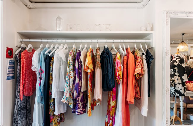 Colourful clothes on racks inside Bunnies Arrowtown.