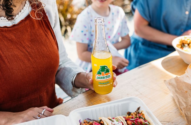 Close up of a glass bottle of Mexican pineapple soda.